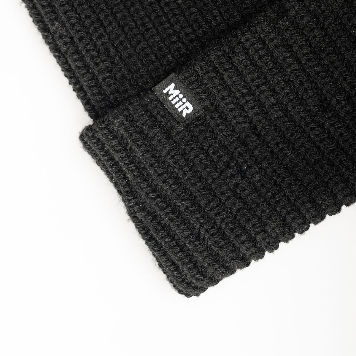 recycled-poly-rib-beanie-a1 WebPDP-RecycledPolyRibBeanie_Studio_TagDetail_Black__BNE002002OS.jpg